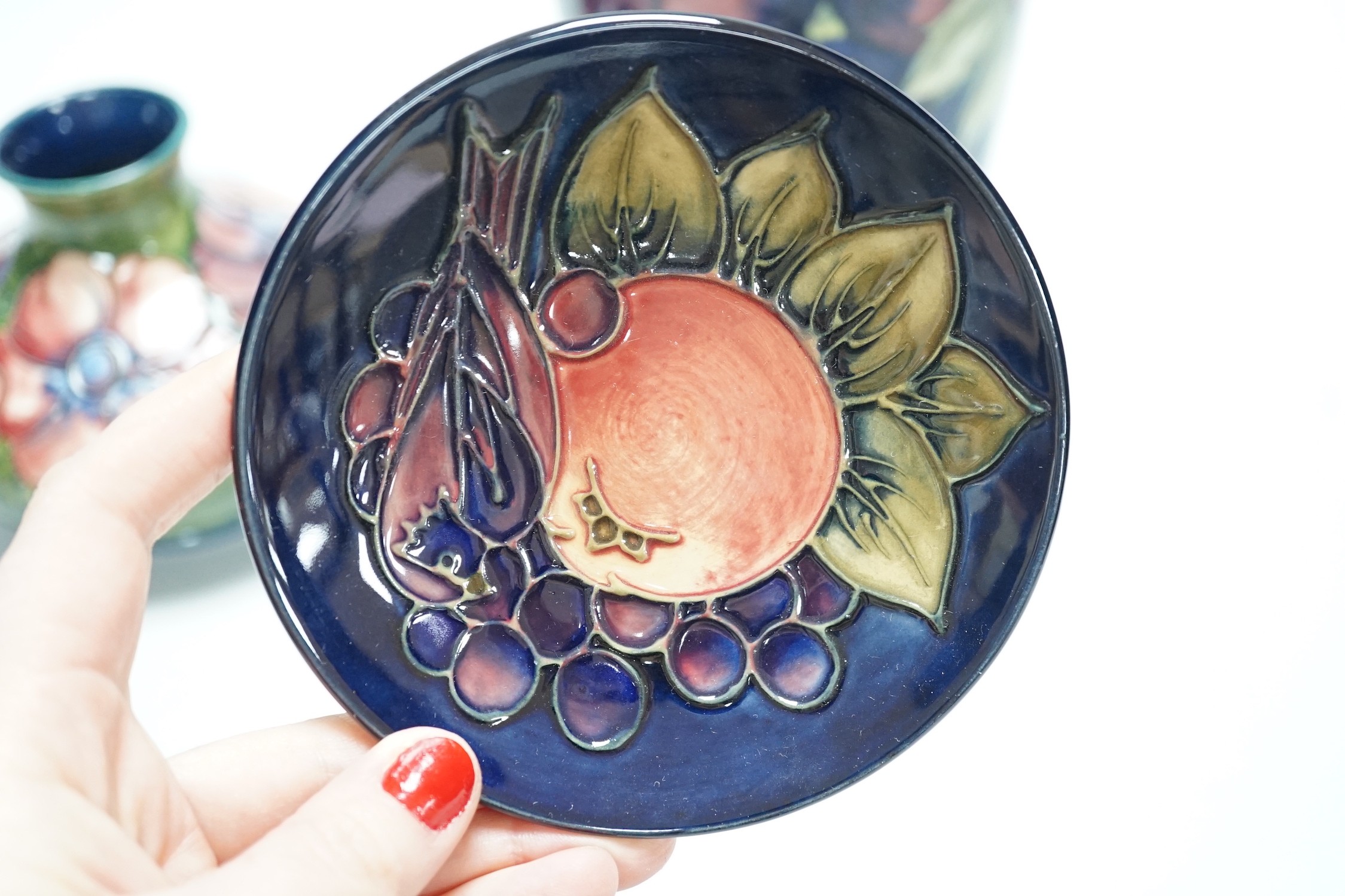 Two Moorcroft vases and a dish, tallest 20cm